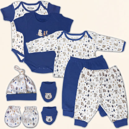 A collection of baby clothing and accessories, including a blue onesie, blue pants, a blue hat, and baby mittens, all featuring a pattern of animals and bears.